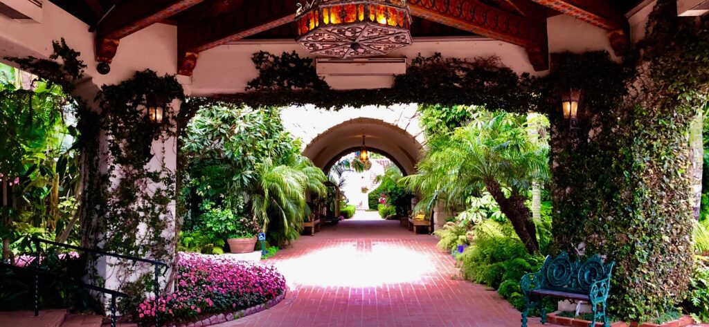 A walkway with flowers and plants in it