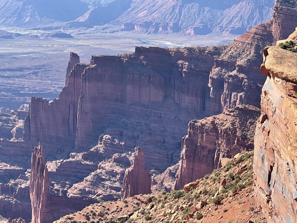 A view of some mountains from the top of a mountain.