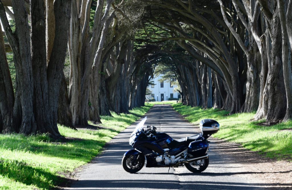 A motorcycle parked on the side of a road.