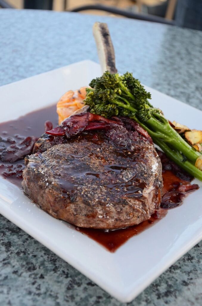 A plate of food with meat and vegetables on it.